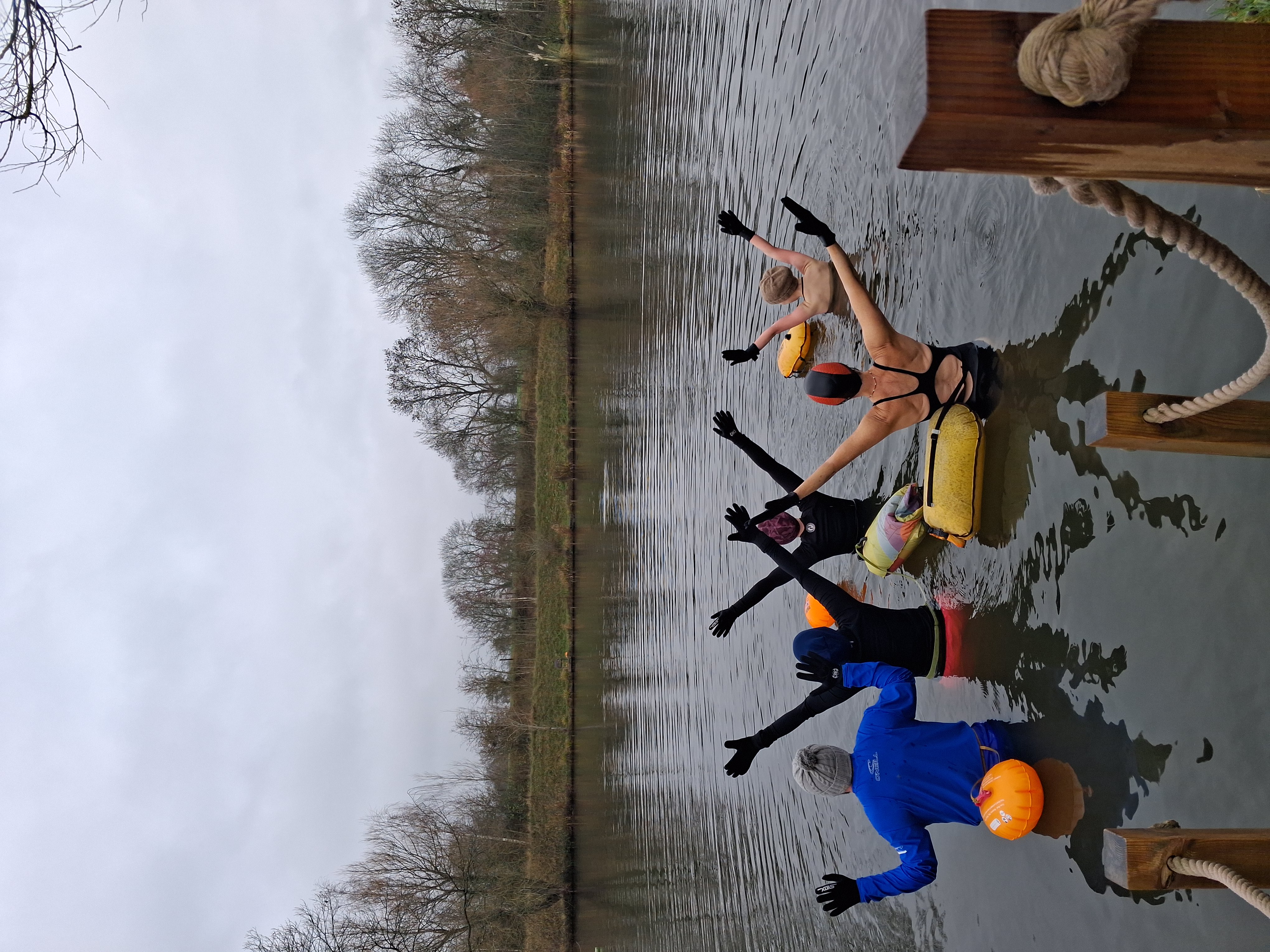 swimmer in lake arms lifted